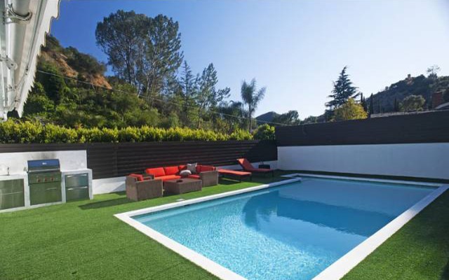 Large modern backyard rectangular lap pool in Los Angeles.