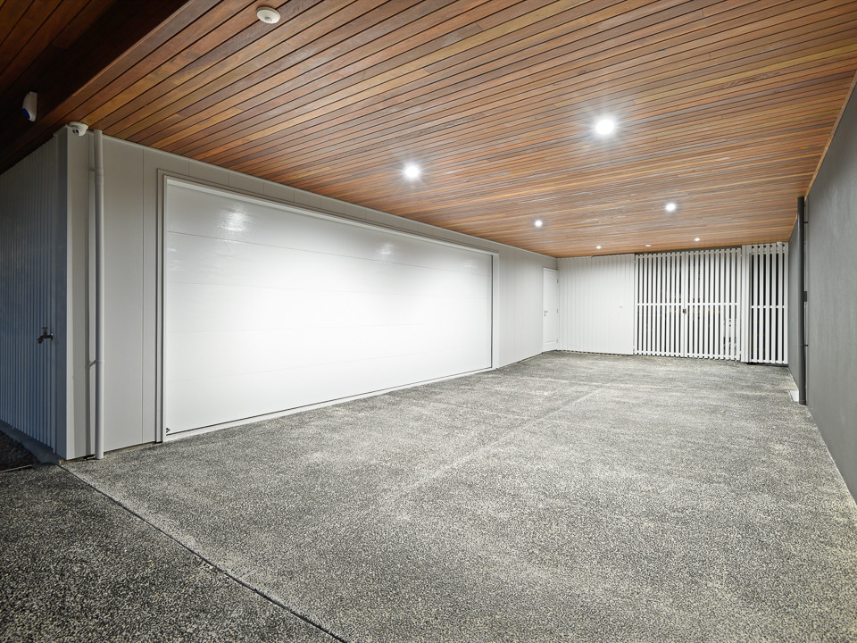 Photo of a contemporary garage in Brisbane.