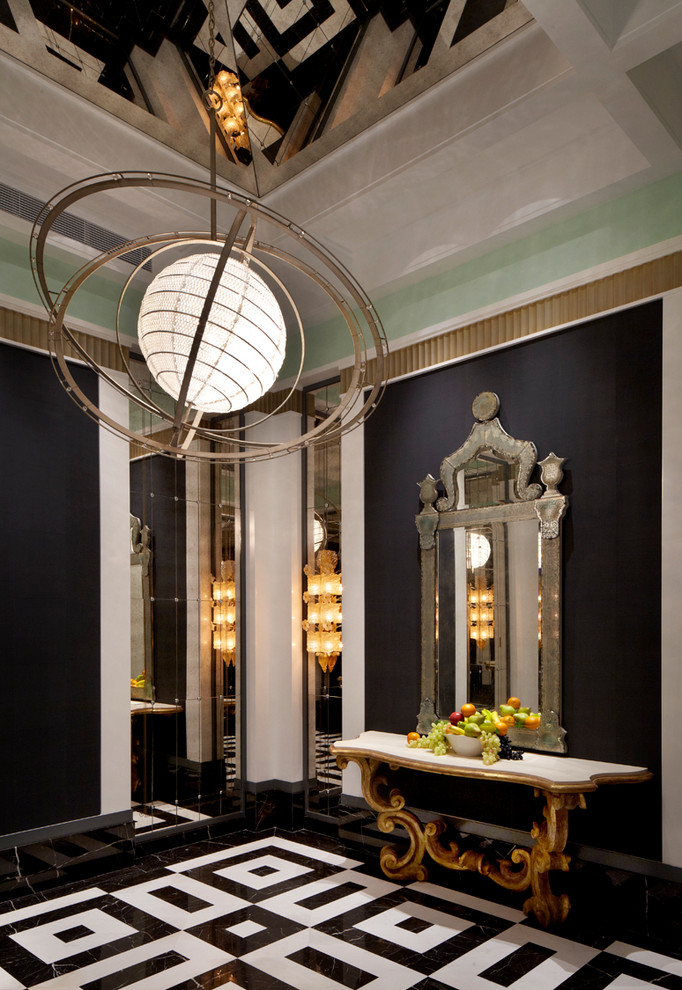 This is an example of an expansive eclectic foyer in Hong Kong with black walls and marble floors.