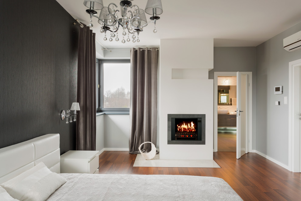 Example of a mid-sized trendy bedroom design in Nashville with a standard fireplace