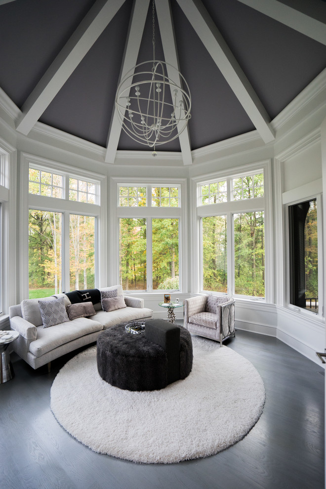 Photo of a large contemporary sunroom in Cleveland with dark hardwood floors, no fireplace, a standard ceiling and brown floor.
