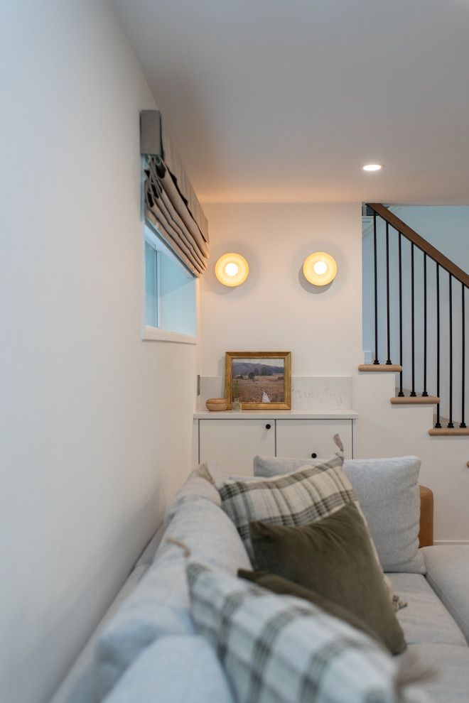Example of a mid-sized transitional basement design in Seattle
