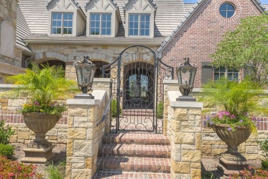 Example of a huge transitional concrete floor front door design in Phoenix with beige walls and a glass front door