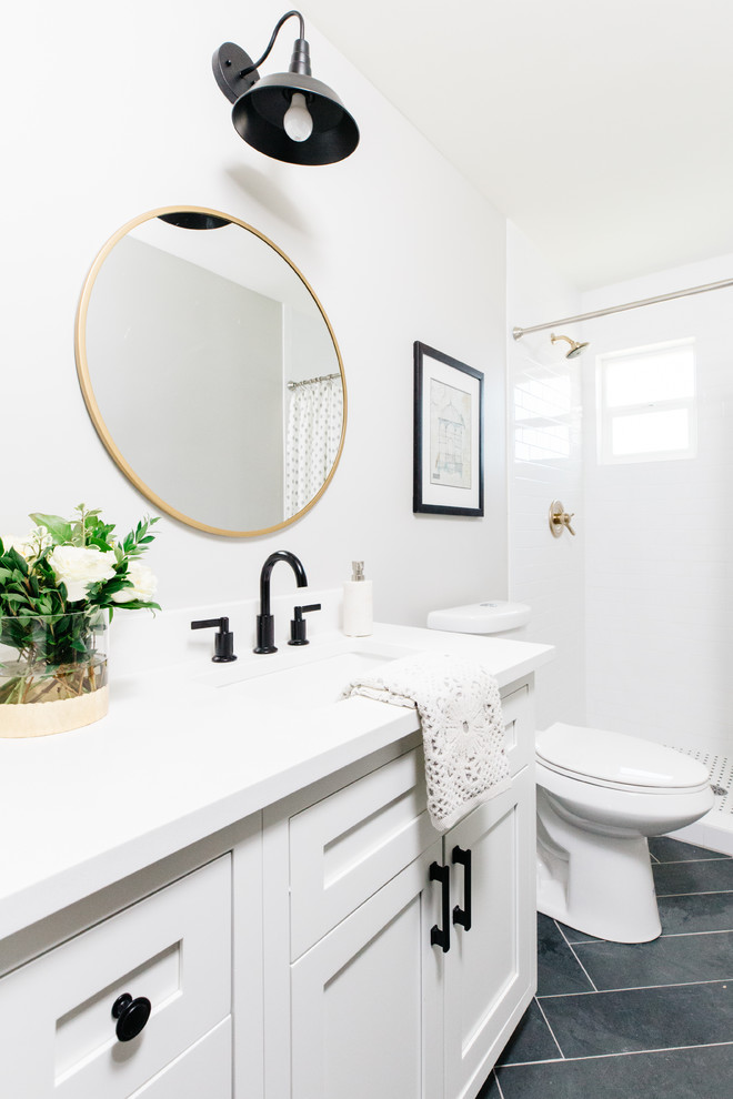 Alcove shower - transitional 3/4 white tile and subway tile slate floor and black floor alcove shower idea in Phoenix with shaker cabinets, white cabinets, white walls and an undermount sink