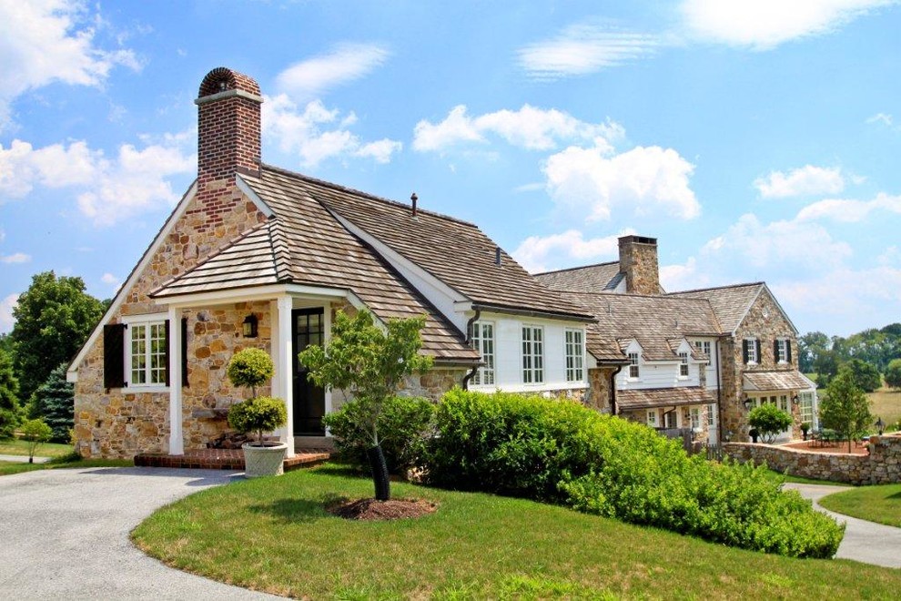 Design ideas for an expansive traditional three-storey white exterior in Philadelphia with mixed siding and a clipped gable roof.