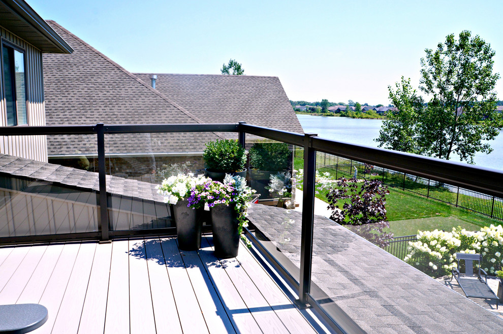 Design ideas for a large transitional backyard deck in Toronto with no cover.