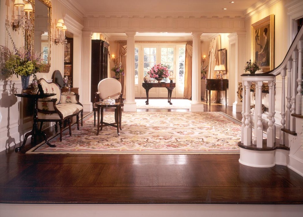 Inspiration for a large traditional entry hall in Other with beige walls, dark hardwood floors, a single front door and a white front door.