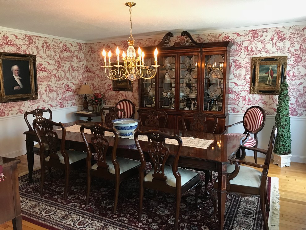 This is an example of a large traditional dining room in New York with light hardwood floors, a brick fireplace surround, beige floor, no fireplace and multi-coloured walls.