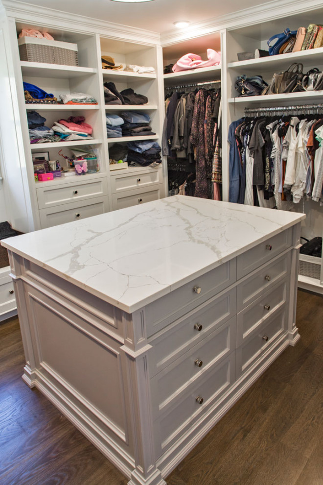 Inspiration for a small classic standard wardrobe for women in New York with white cabinets.