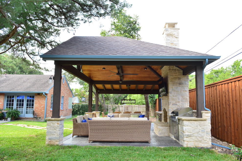 Inspiration for a country backyard patio in Dallas with an outdoor kitchen and stamped concrete.