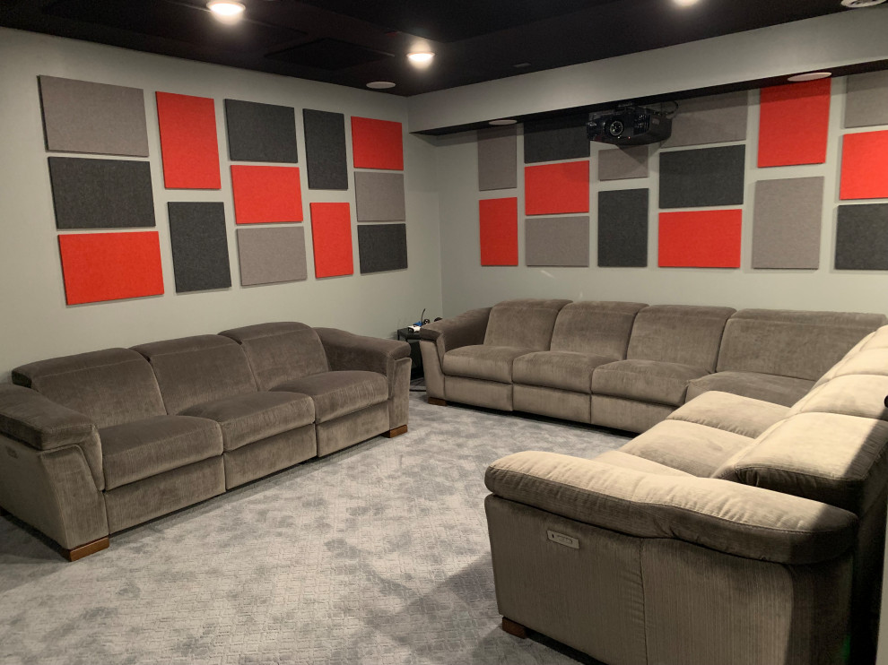 Inspiration for a large classic open plan home cinema in Cincinnati with white walls, laminate floors, a built-in media unit and brown floors.