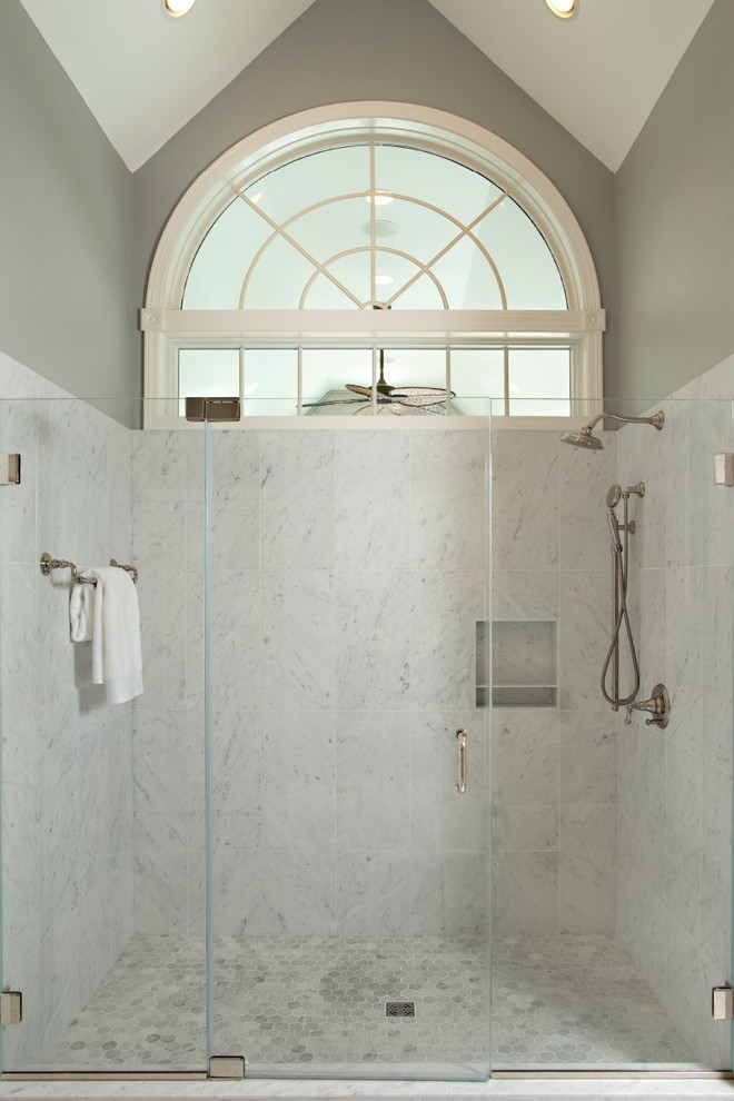 Design ideas for a large transitional master bathroom in Detroit with glass-front cabinets, white cabinets, a double shower, a two-piece toilet, white tile, marble, grey walls, marble floors, an undermount sink, marble benchtops and white floor.