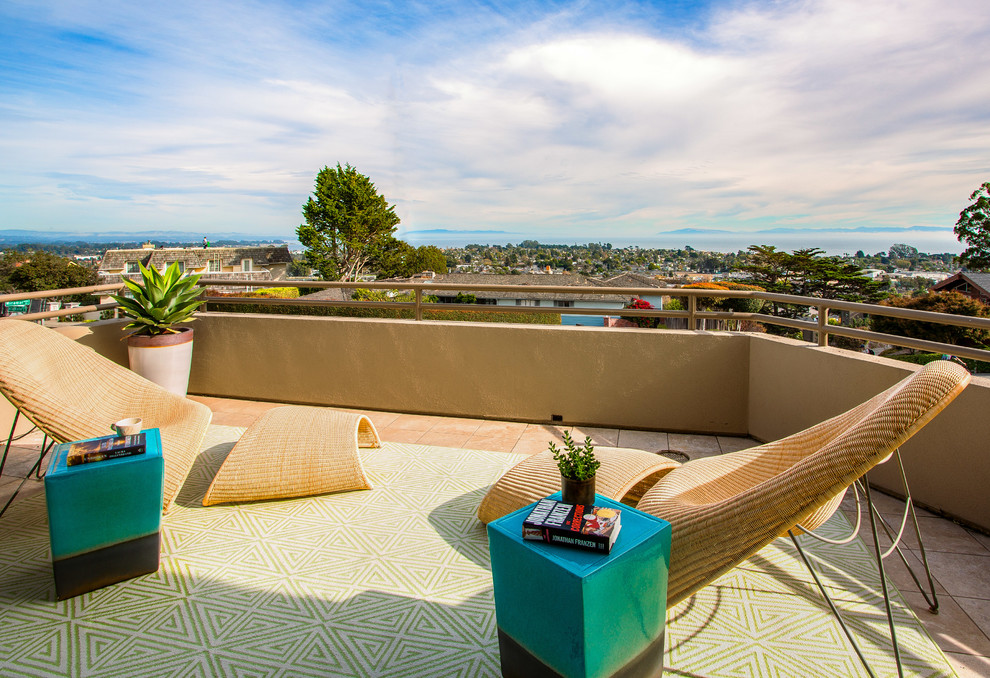Example of a mid-sized minimalist backyard tile patio design in San Francisco with no cover
