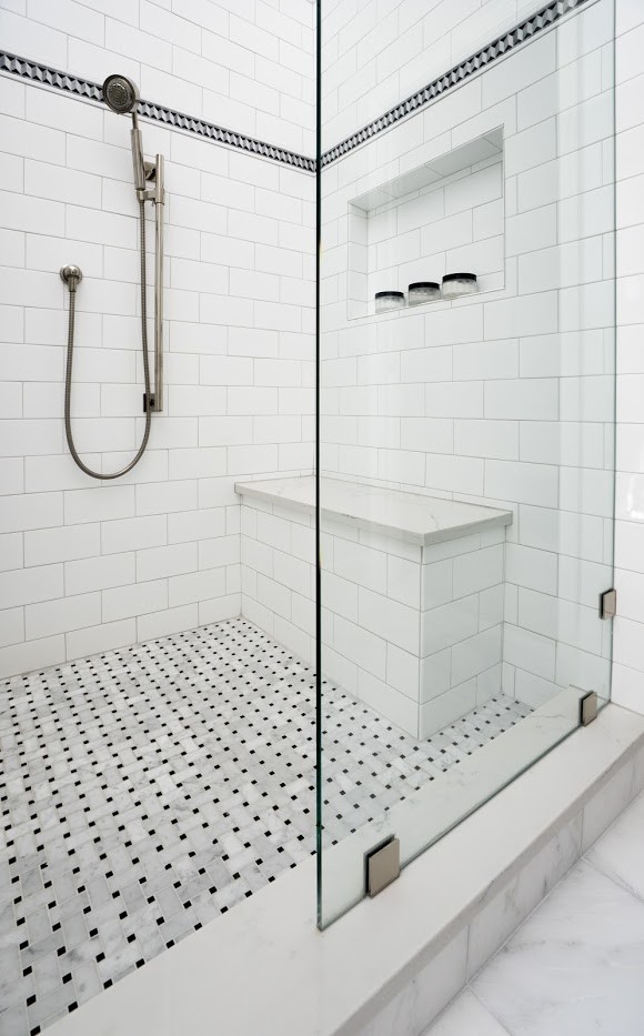Photo of a mid-sized contemporary master bathroom in Chicago with white cabinets, a corner shower, a two-piece toilet, white tile, ceramic tile, blue walls, marble floors, an undermount sink, tile benchtops, grey floor, a hinged shower door and black benchtops.