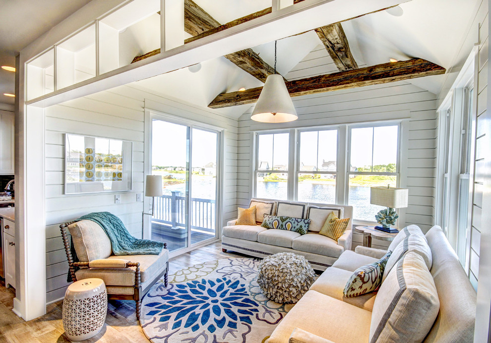 Beach style sunroom in Grand Rapids with a standard ceiling and brown floor.