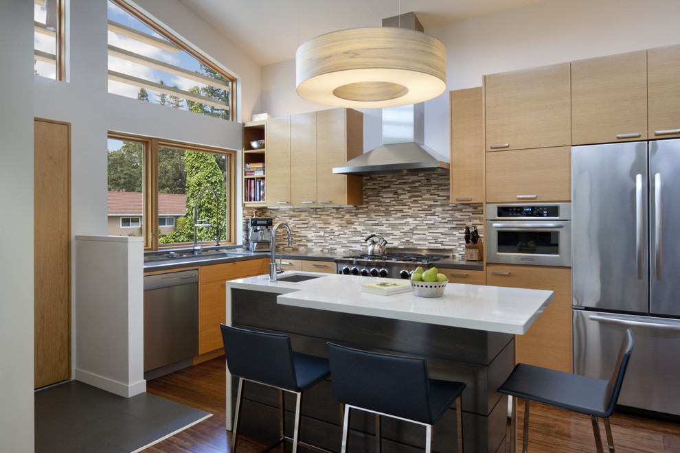 Inspiration for a mid-sized contemporary l-shaped eat-in kitchen in San Francisco with matchstick tile splashback, stainless steel appliances, brown splashback, medium wood cabinets, flat-panel cabinets, an undermount sink, with island and medium hardwood floors.