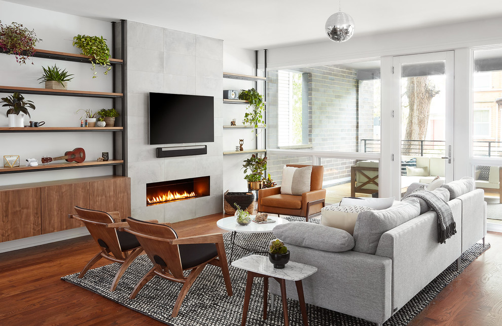 Inspiration for a mid-sized contemporary open concept living room in Chicago with a music area, grey walls, medium hardwood floors, a ribbon fireplace, a wall-mounted tv and brown floor.