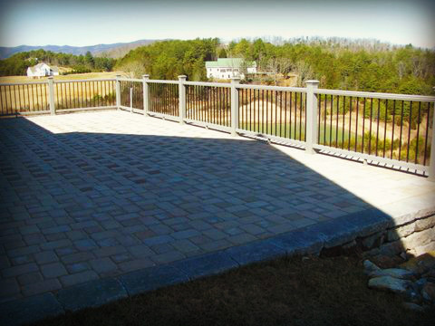 Patio kitchen - large rustic backyard concrete paver patio kitchen idea with no cover