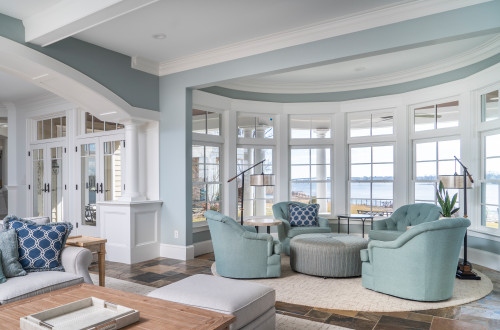  Living room with calming ambiance, soft blue paint colour and beige hues.
