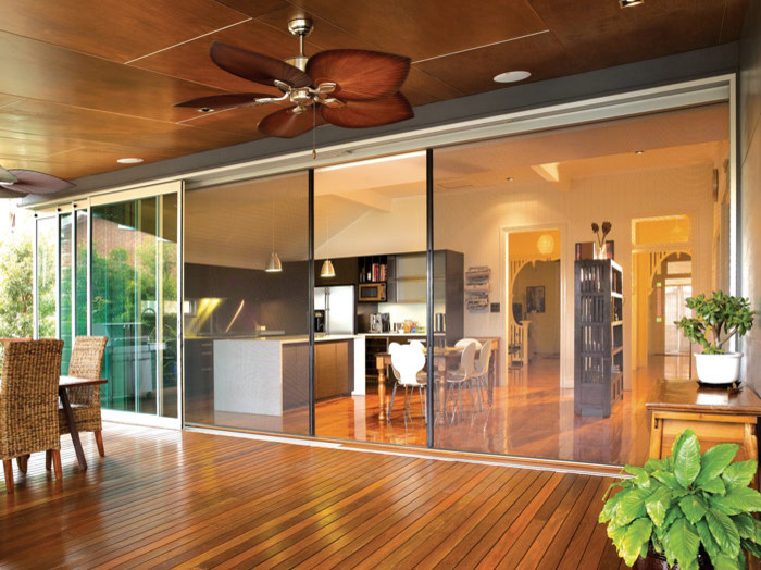 Large minimalist back porch idea in Hawaii with decking and a roof extension