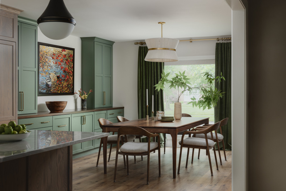 Inspiration for a transitional medium tone wood floor and brown floor dining room remodel in Louisville with white walls