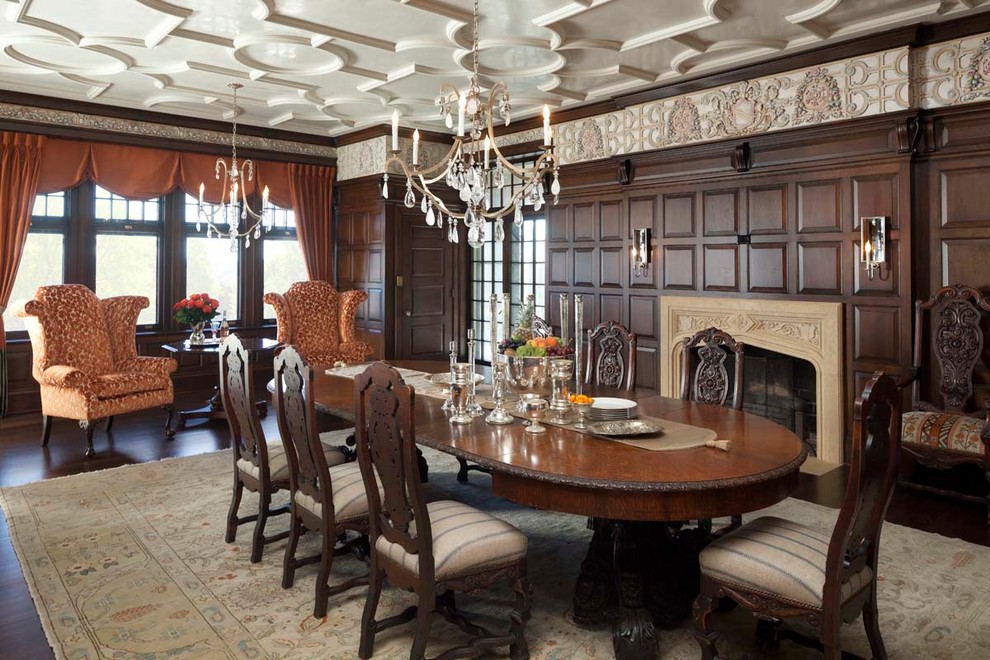 Large traditional separate dining room in Minneapolis with brown walls, dark hardwood floors, a standard fireplace and a stone fireplace surround.