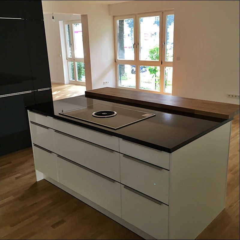 Inspiration for a large contemporary u-shaped open plan kitchen in Munich with flat-panel cabinets, white cabinets, granite benchtops, metallic splashback, stainless steel appliances and with island.