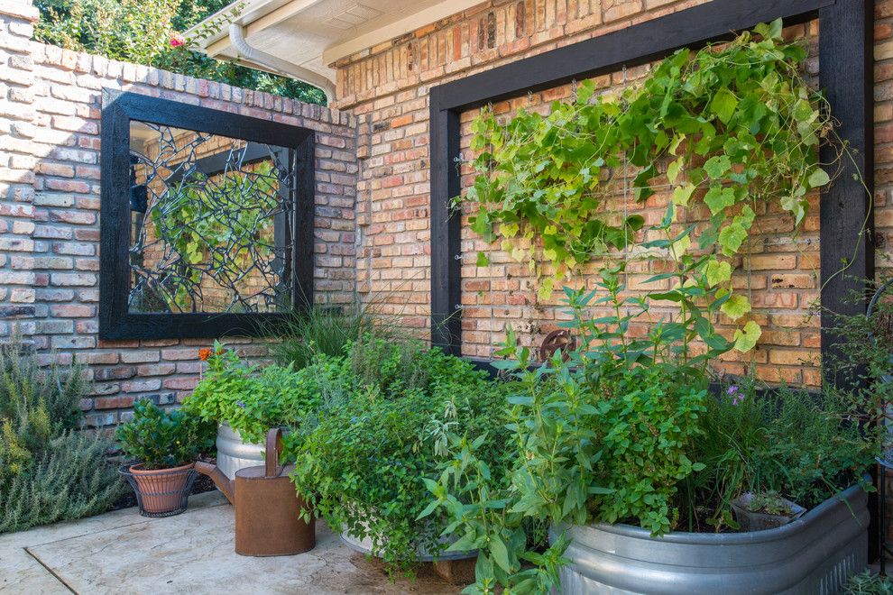 Inspiration for an eclectic side yard patio in Dallas with a vegetable garden and stamped concrete.