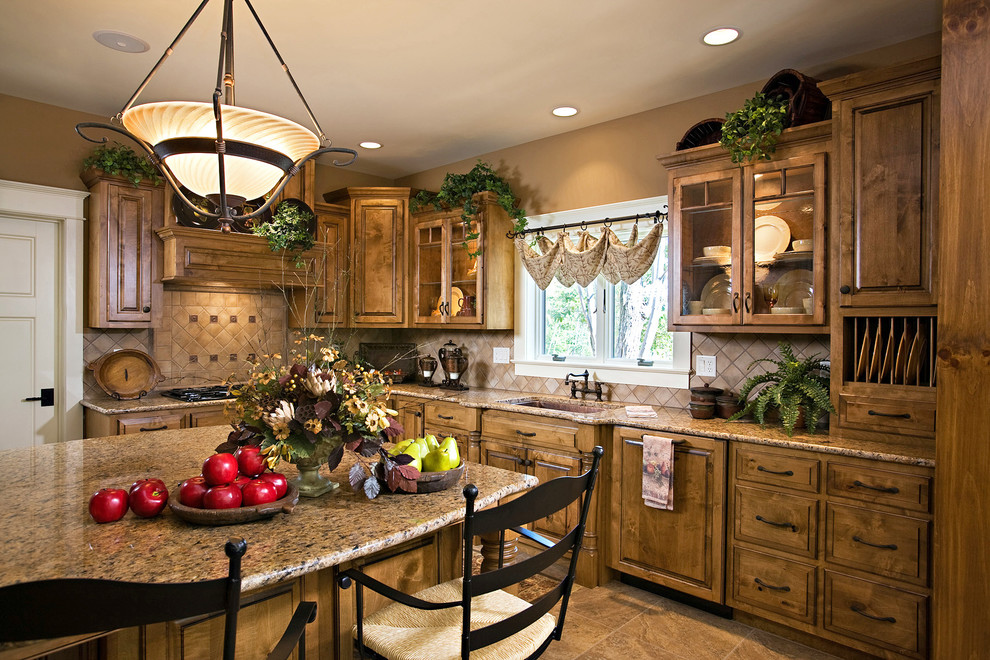 Inspiration for a mid-sized rustic u-shaped ceramic tile eat-in kitchen remodel with an undermount sink, granite countertops, beige backsplash, ceramic backsplash, paneled appliances, an island, raised-panel cabinets and medium tone wood cabinets