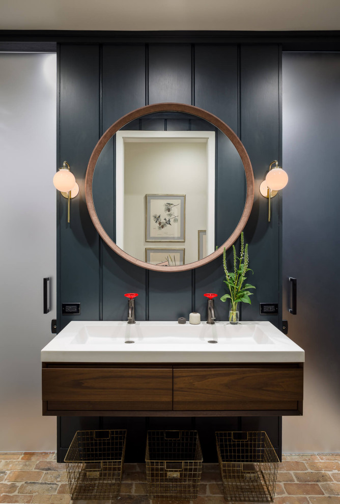 Photo of a transitional 3/4 bathroom in Chicago with flat-panel cabinets, medium wood cabinets, brick floors, an integrated sink, engineered quartz benchtops, multi-coloured floor, white benchtops, a double vanity, a floating vanity and panelled walls.