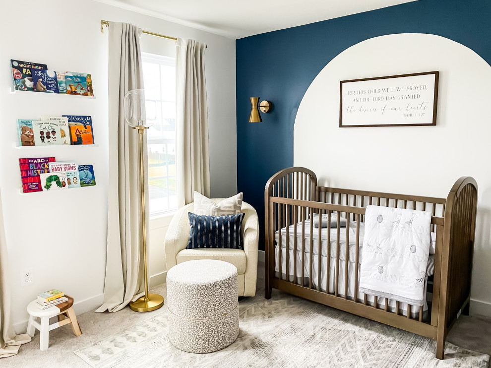 Medium sized nautical nursery for boys in DC Metro with white walls, carpet and beige floors.