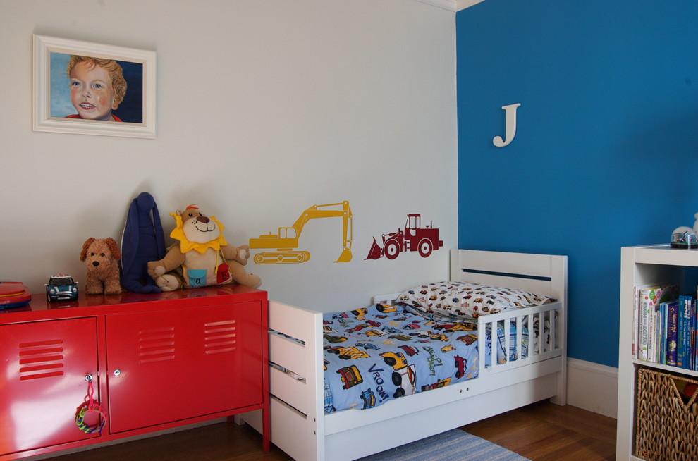 Photo of a contemporary kids' room for boys in San Francisco with medium hardwood floors and multi-coloured walls.