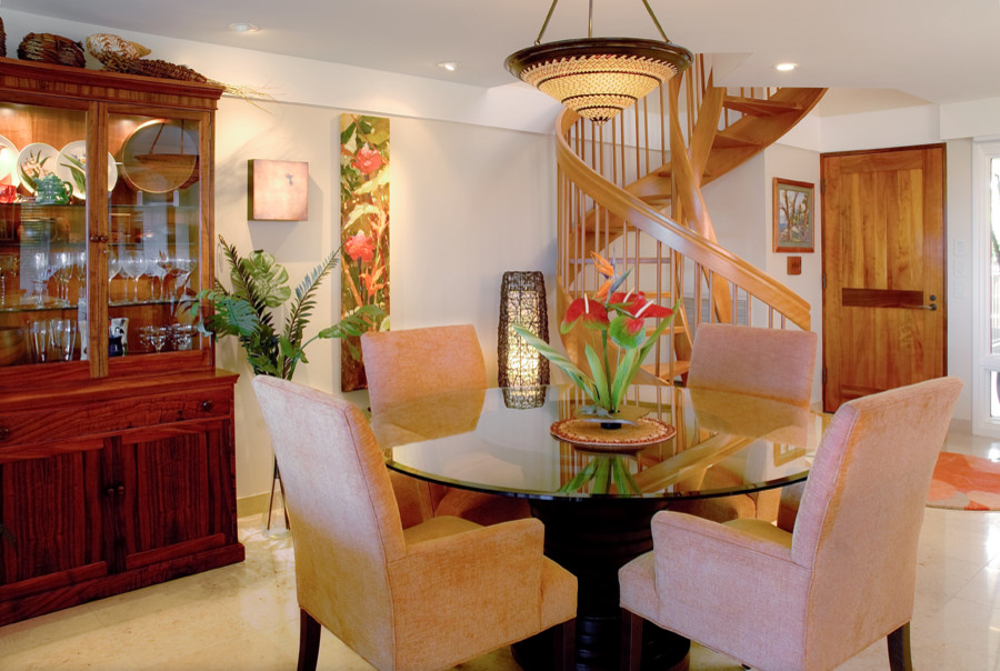 This is an example of a mid-sized tropical kitchen/dining combo in Hawaii with beige walls and marble floors.