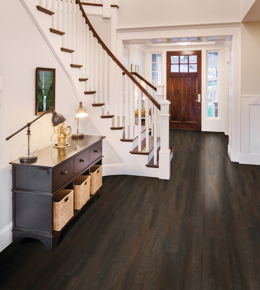 Foyer - mid-sized transitional dark wood floor foyer idea with white walls and a dark wood front door