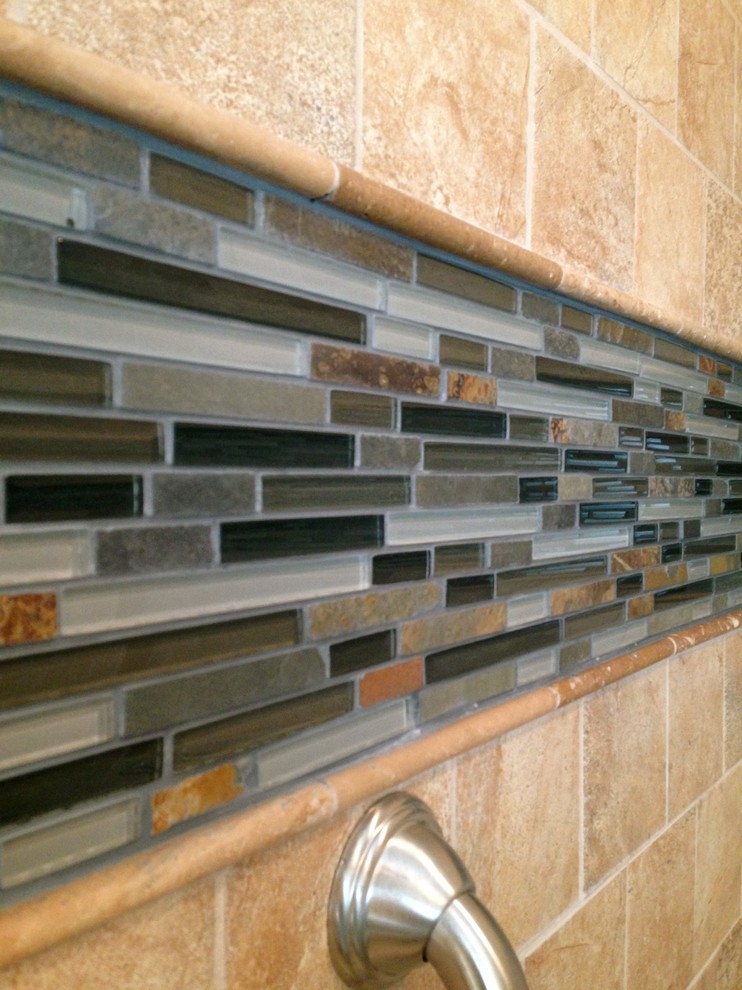 Alcove shower - mid-sized transitional master beige tile and porcelain tile porcelain tile alcove shower idea with raised-panel cabinets, white cabinets, a two-piece toilet and blue walls