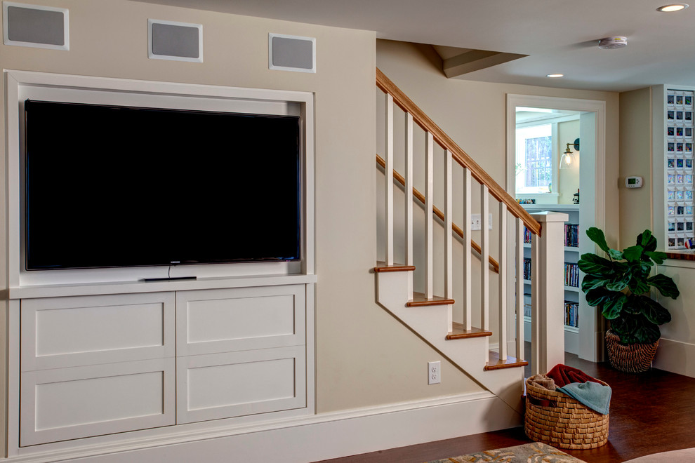 This is an example of a transitional family room in Seattle with a built-in media wall.