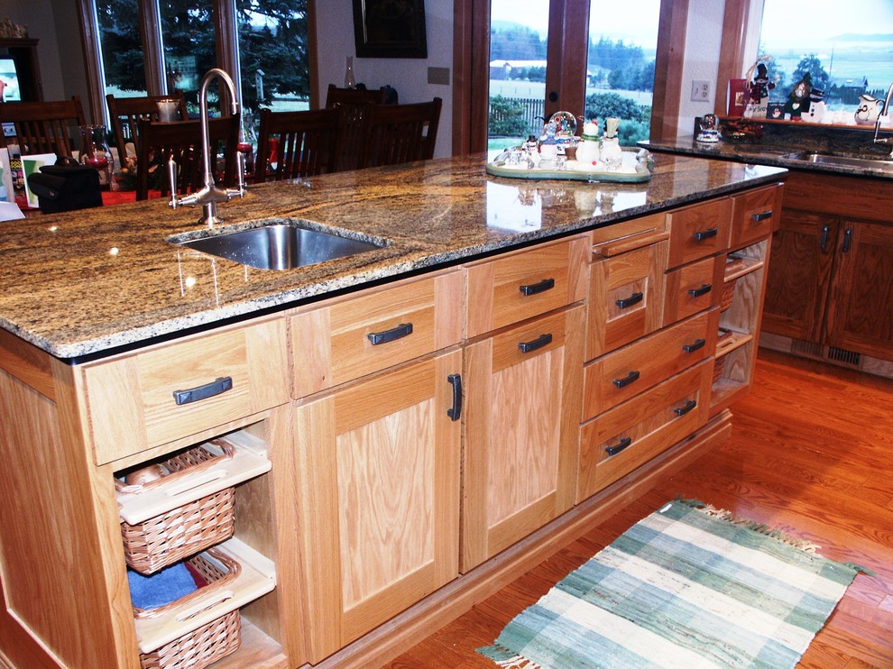 Inspiration for a transitional kitchen remodel in Seattle with an undermount sink, shaker cabinets, light wood cabinets and granite countertops