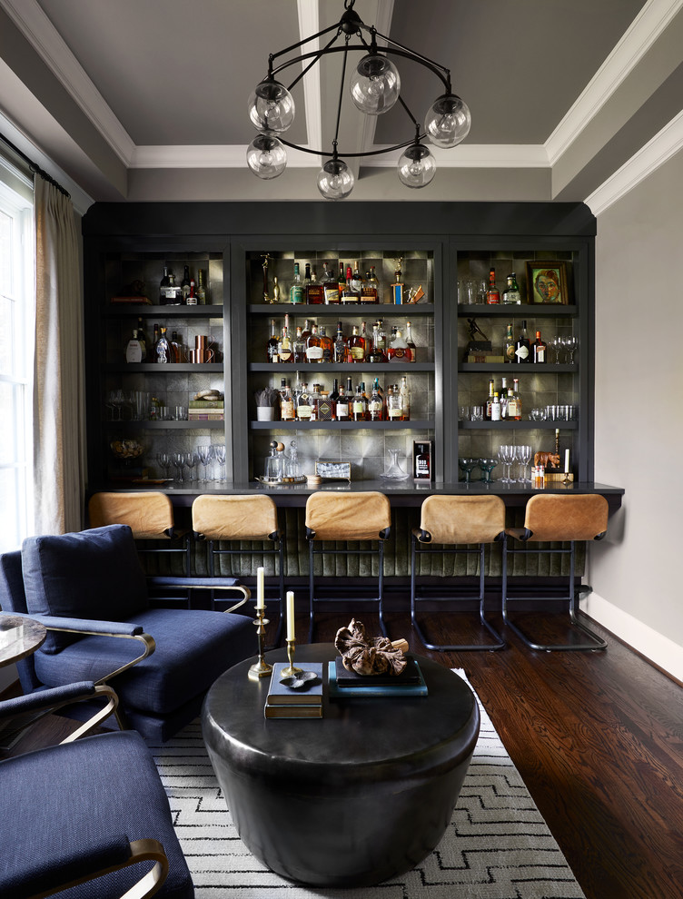 Small contemporary single-wall seated home bar in Nashville with open cabinets, grey cabinets, quartz benchtops, grey splashback, dark hardwood floors, grey benchtop and metal splashback.