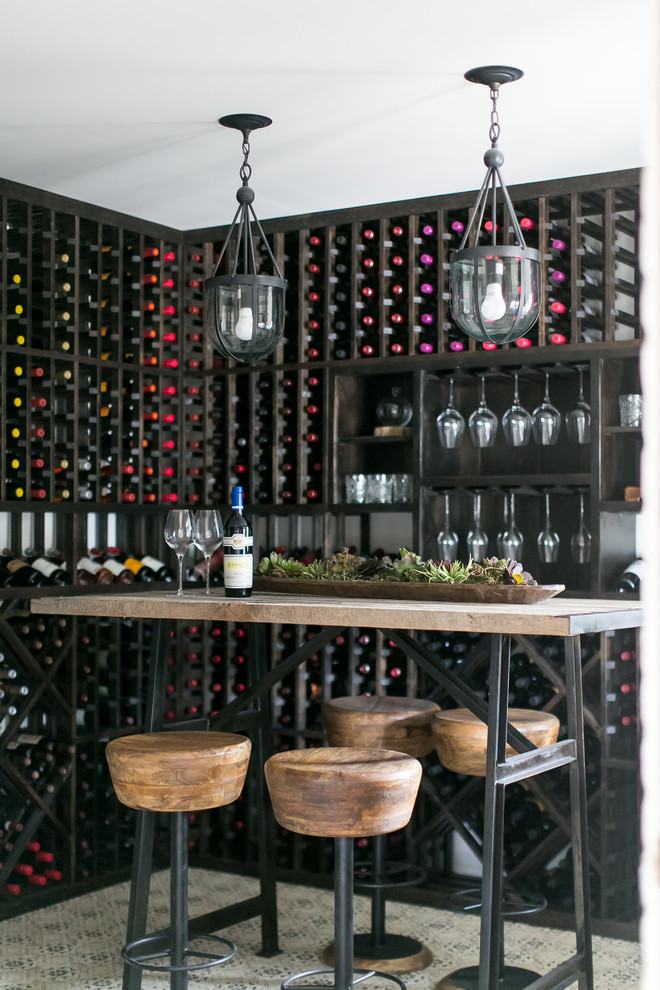 Small country wine cellar in San Diego with ceramic floors, storage racks and multi-coloured floor.
