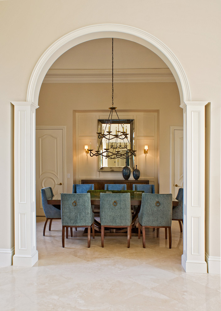 Inspiration for a traditional separate dining room in Miami with beige walls and beige floor.