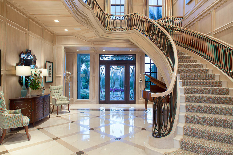 Design ideas for a traditional foyer in Miami with a single front door, a glass front door and marble floors.