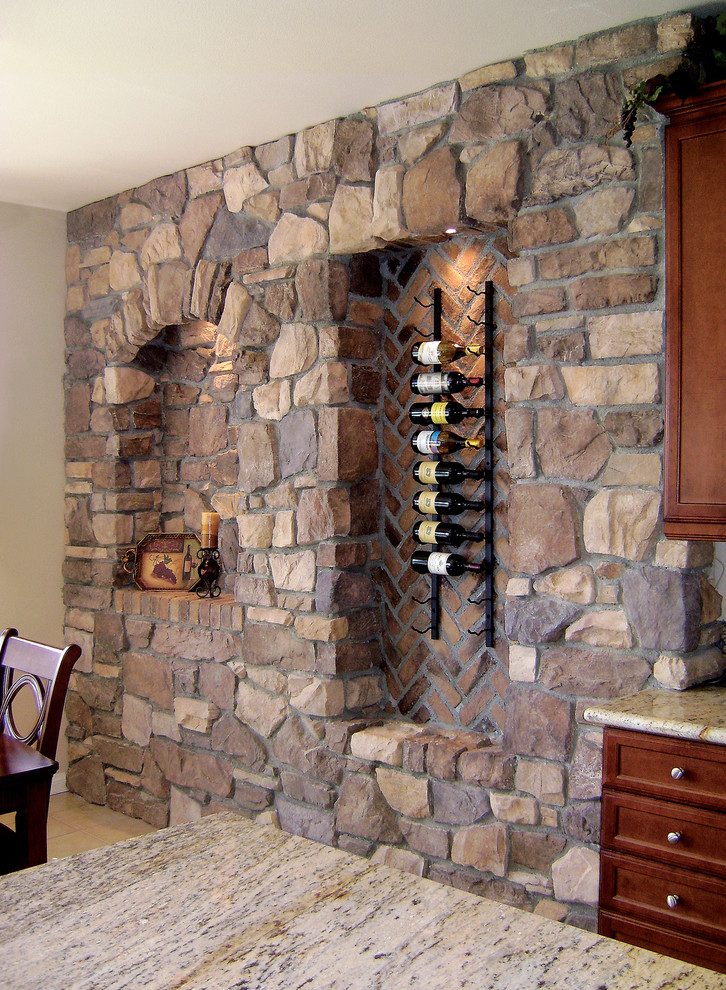 This is an example of a mid-sized mediterranean wine cellar in Los Angeles with storage racks.