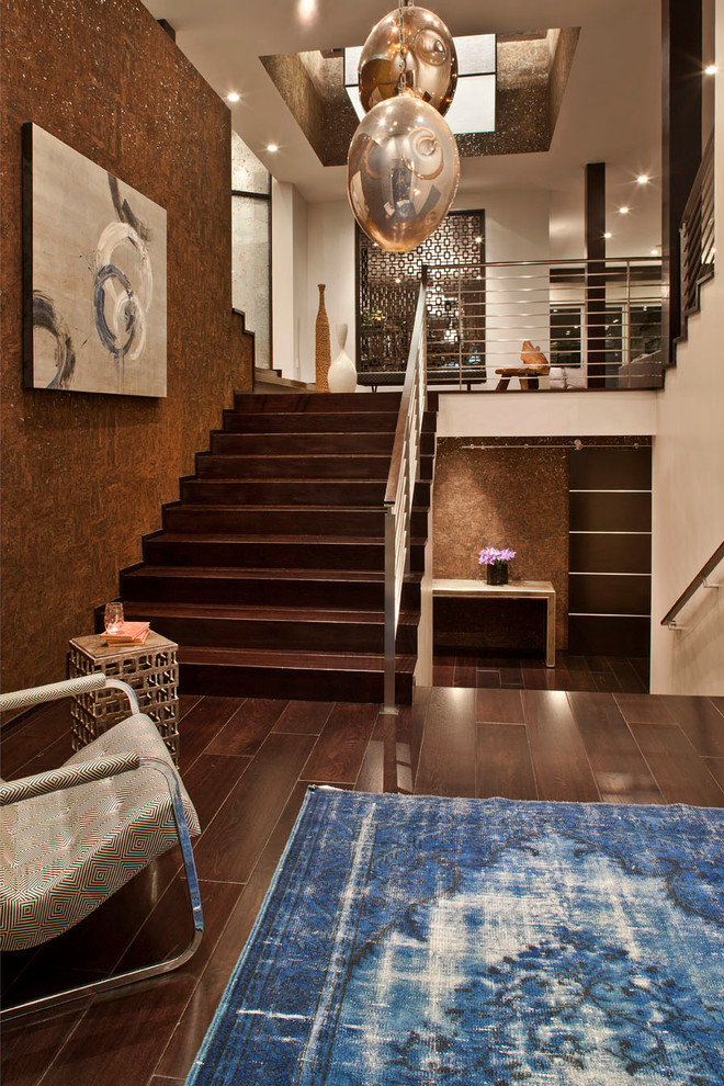 Design ideas for a contemporary wood straight staircase in Los Angeles with wood risers.