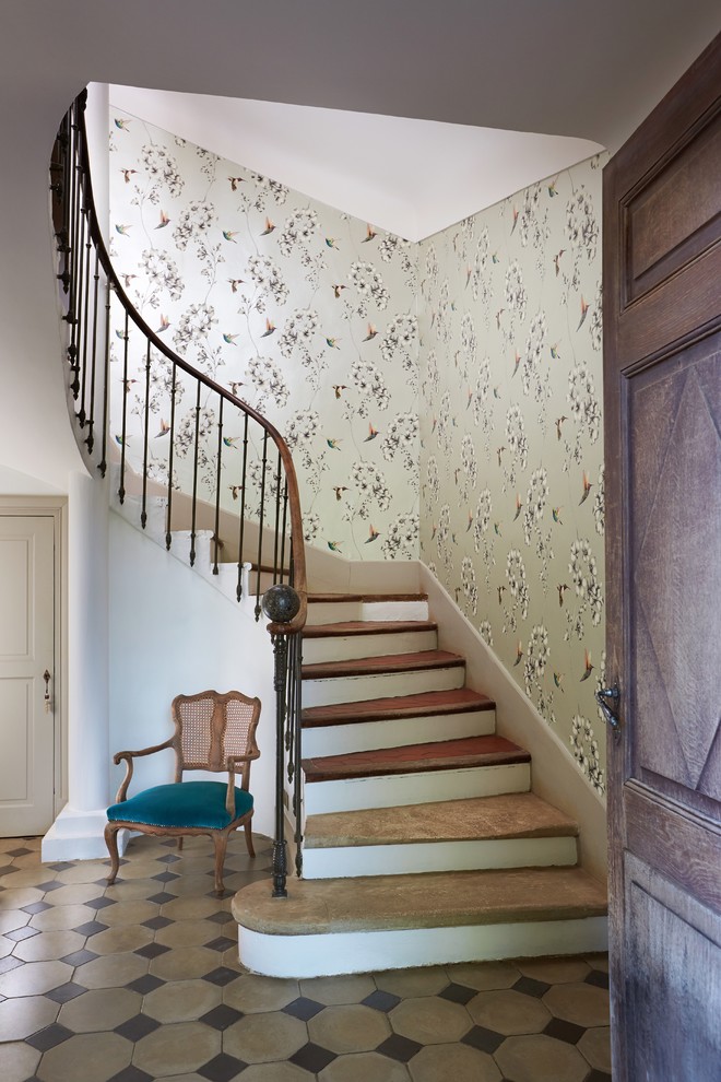Design ideas for a traditional curved staircase in West Midlands with metal railing.