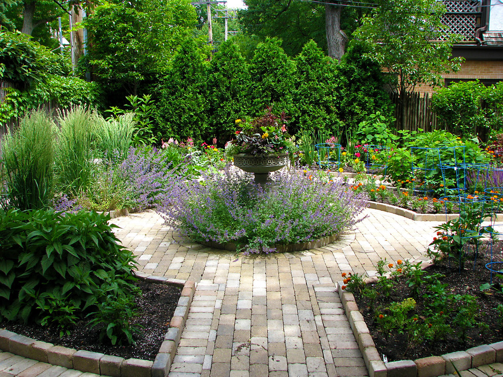 Photo of a small traditional backyard partial sun garden in Chicago with a vegetable garden and brick pavers.