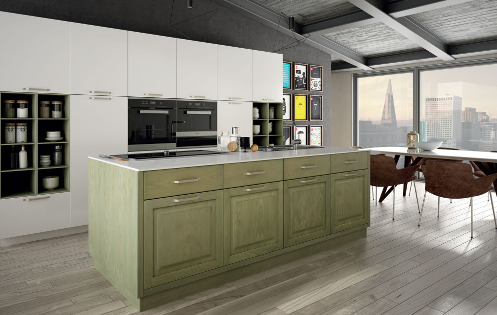 Ejemplo de cocina actual grande con electrodomésticos de acero inoxidable, suelo de madera clara, una isla y encimeras blancas