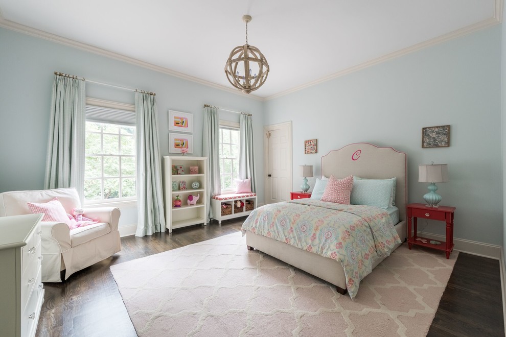 Photo of a transitional kids' bedroom in Atlanta with blue walls, dark hardwood floors and brown floor.