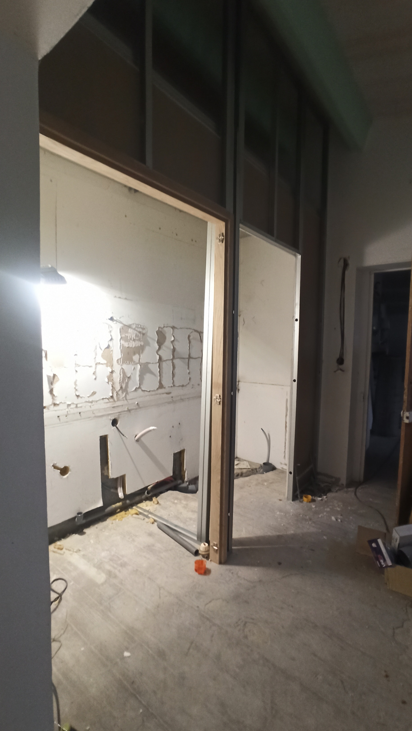 Transformation d'une chambre parentale en pièce de vie/cuisine