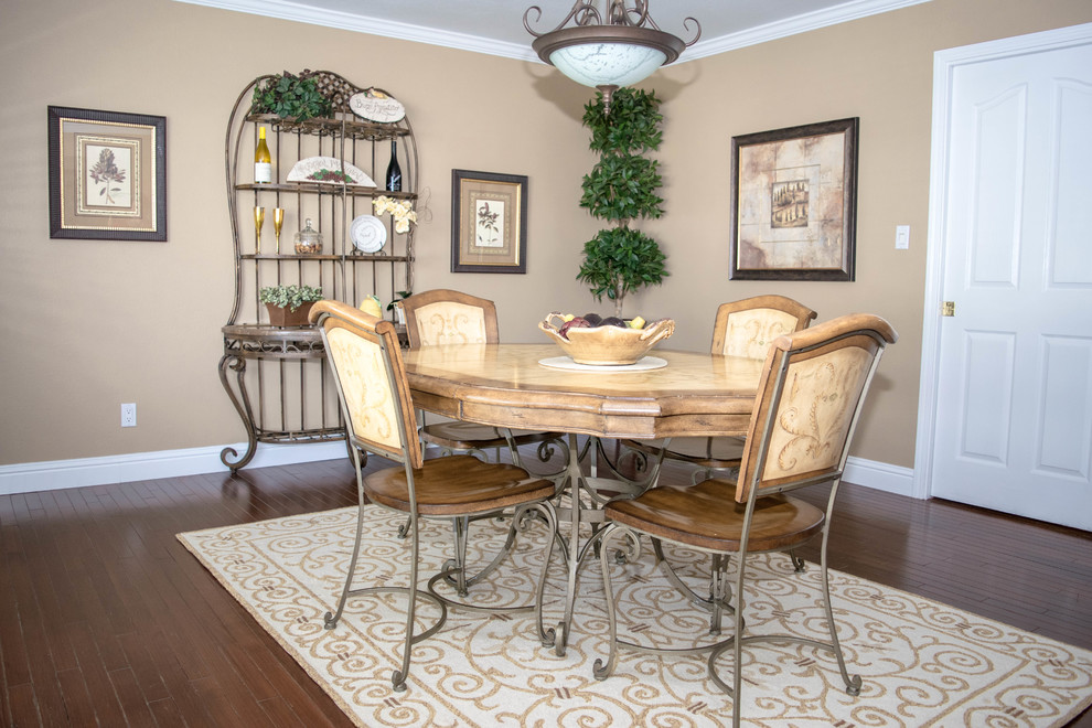 Enclosed dining room - mid-sized transitional dark wood floor and brown floor enclosed dining room idea in Sacramento with beige walls and no fireplace