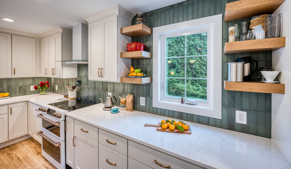 Kitchen - large transitional kitchen idea in DC Metro with flat-panel cabinets, white cabinets, quartz countertops, green backsplash, ceramic backsplash, an island and white countertops